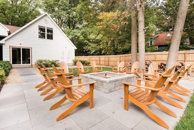 15963 Lakeshore Rd, Union Pier, MI 49129 - view of patio featuring fence and a fire pit