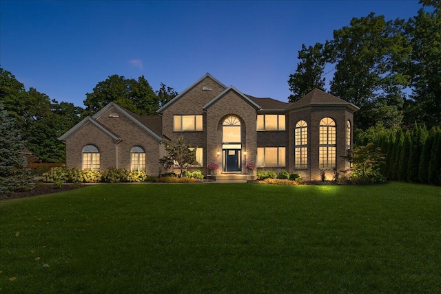 french country style house featuring a yard