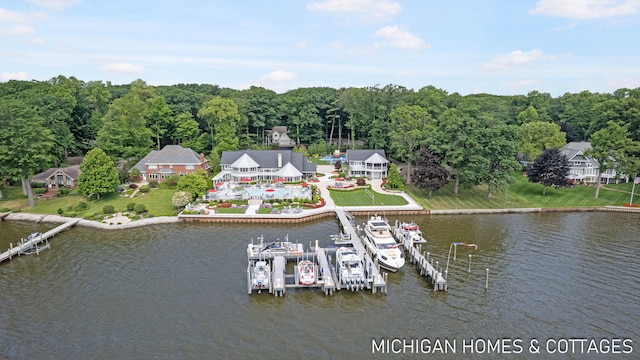 birds eye view of property with a water view