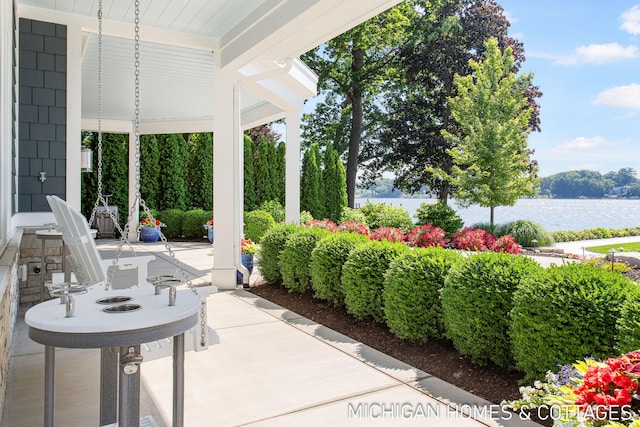 view of patio / terrace with a water view