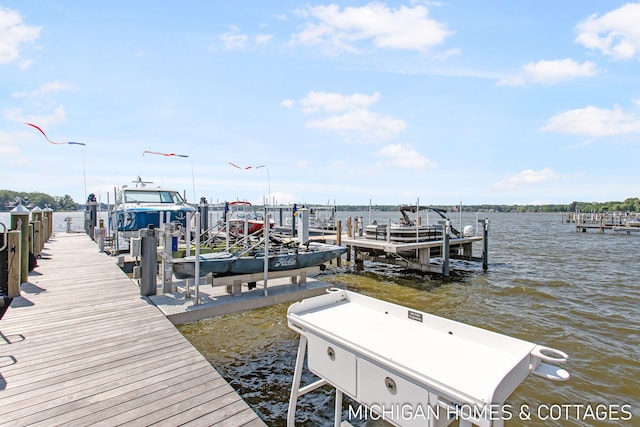 view of dock with a water view