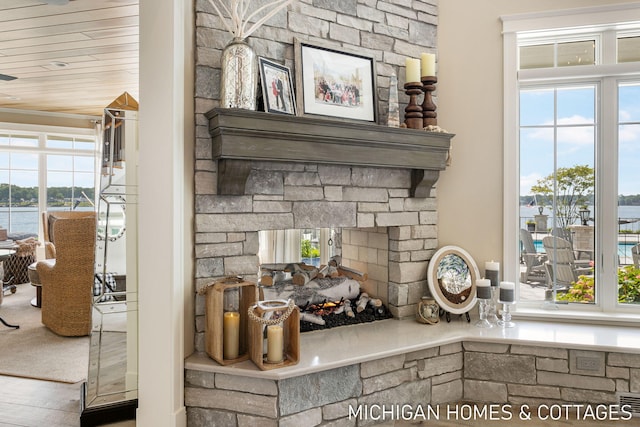 room details featuring a fireplace and wooden ceiling