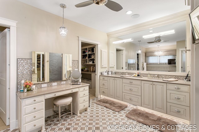 bathroom featuring vanity, decorative backsplash, and ceiling fan