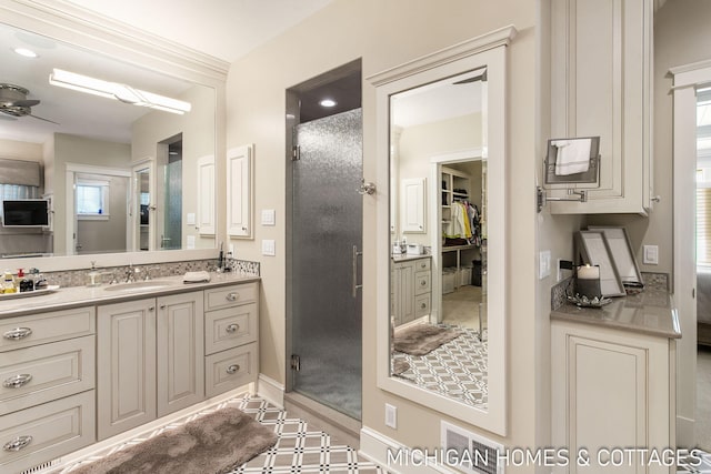 bathroom featuring vanity and ceiling fan