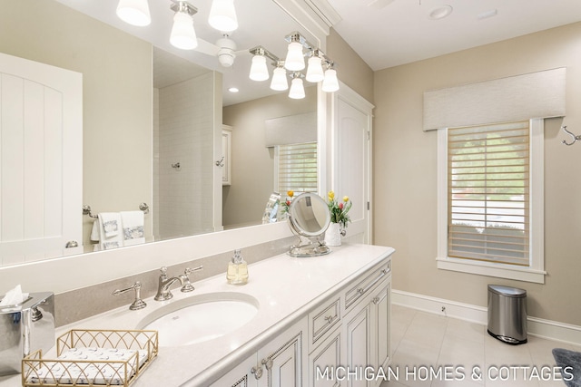 bathroom with walk in shower, tile patterned floors, and vanity