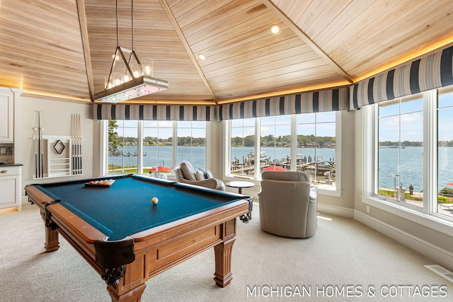 playroom with light carpet, wooden ceiling, and a water view