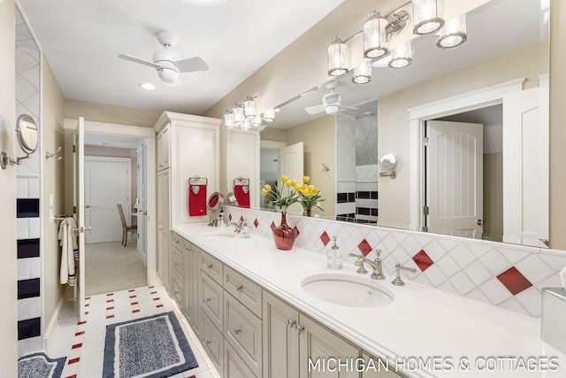 bathroom featuring vanity, backsplash, and ceiling fan