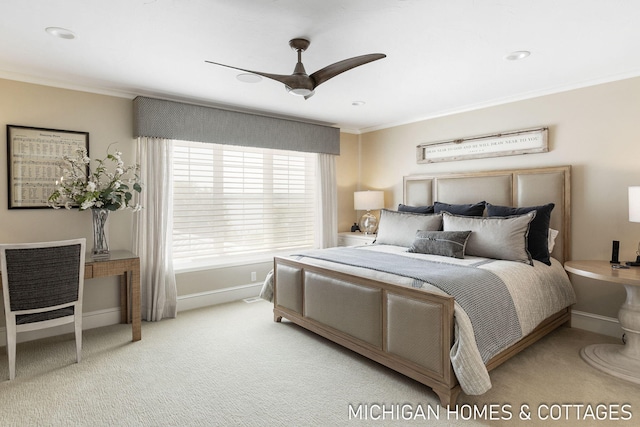 carpeted bedroom with crown molding and ceiling fan