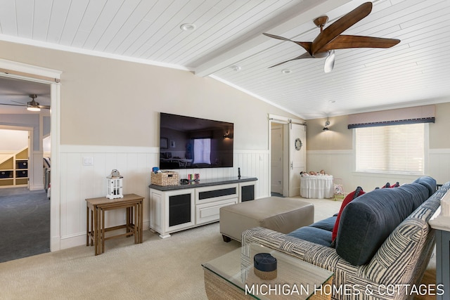 carpeted living room with ceiling fan, a barn door, vaulted ceiling, and wooden ceiling