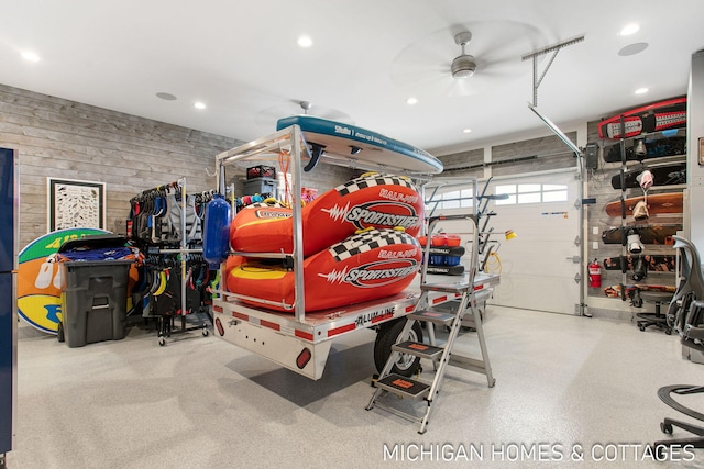 garage with wooden walls and ceiling fan