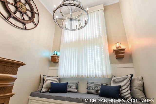 sitting room with a chandelier and a healthy amount of sunlight