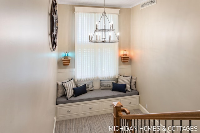 mudroom featuring an inviting chandelier