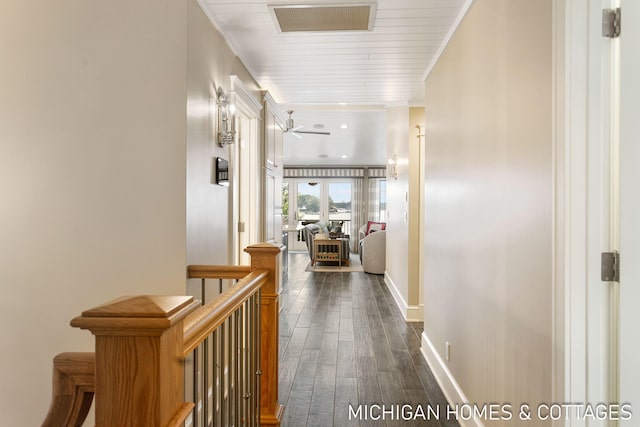 hall featuring crown molding and dark hardwood / wood-style flooring