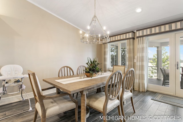 dining area with a notable chandelier and ornamental molding