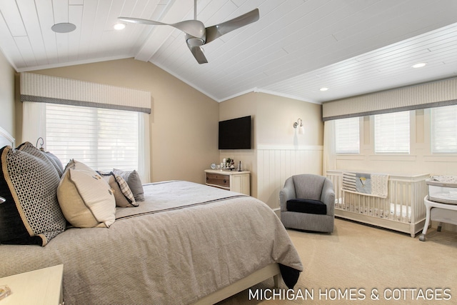 carpeted bedroom with wood ceiling, ceiling fan, crown molding, and vaulted ceiling