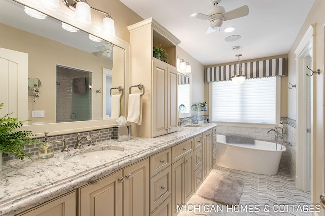 bathroom featuring vanity, separate shower and tub, tile walls, and ceiling fan