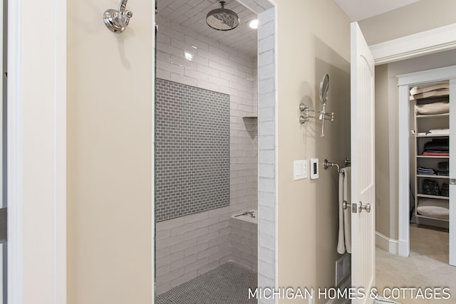 bathroom with a tile shower