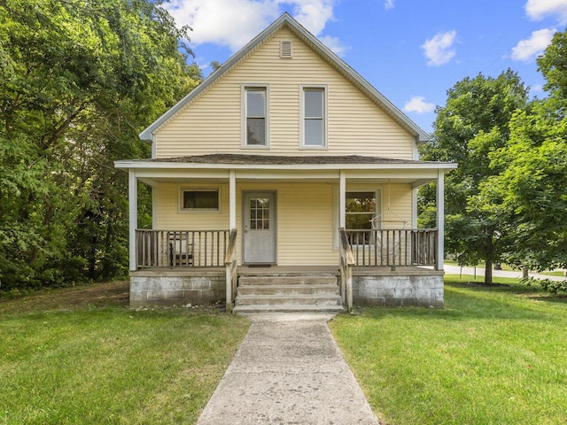 bungalow featuring a porch and a front yard