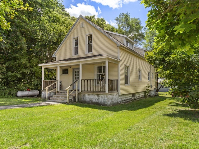 farmhouse featuring a porch and a front lawn