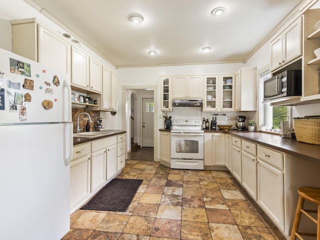 kitchen featuring crown molding, white appliances, sink, and white cabinets