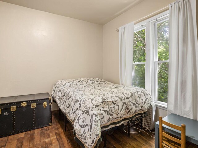 bedroom featuring dark hardwood / wood-style flooring