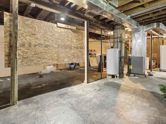 basement with water heater and heating unit