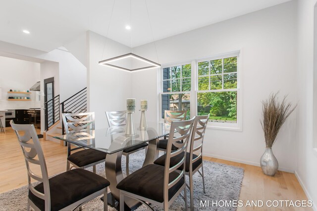 dining space featuring light hardwood / wood-style floors and a wealth of natural light