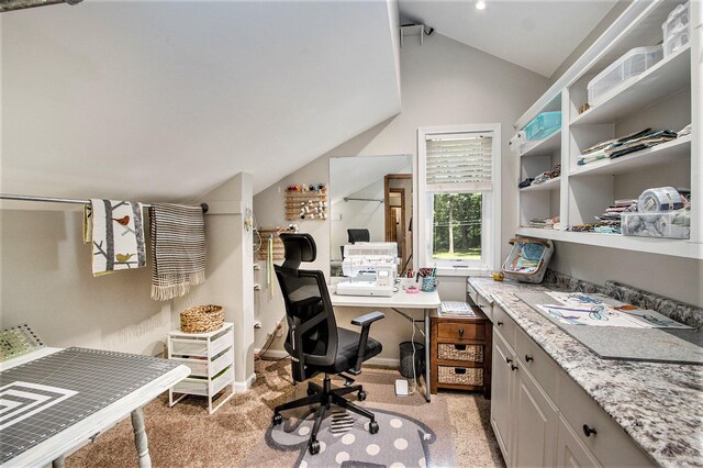 office area with light carpet and lofted ceiling