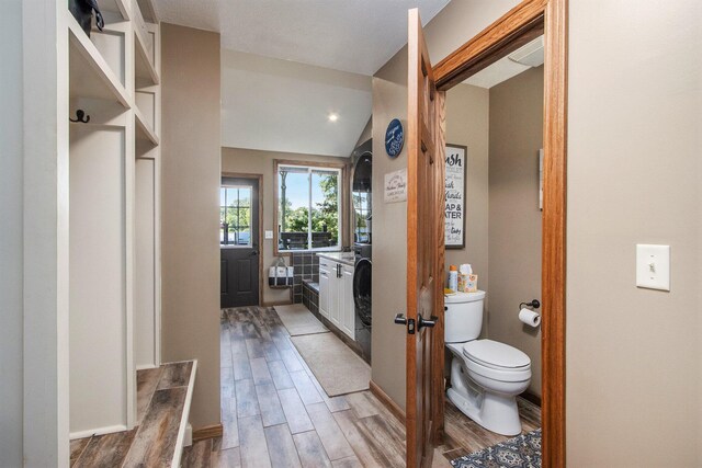 bathroom with vanity, lofted ceiling, toilet, and hardwood / wood-style flooring