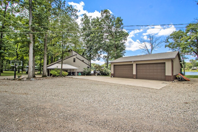 view of front facade with a garage and an outdoor structure