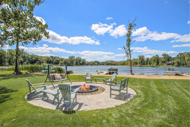 view of patio featuring a water view and a fire pit