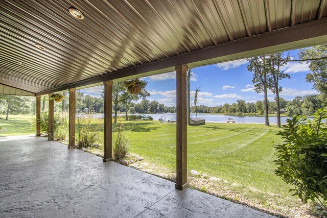 unfurnished sunroom with a water view