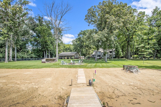 view of dock with a yard