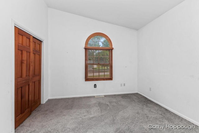 empty room featuring carpet floors