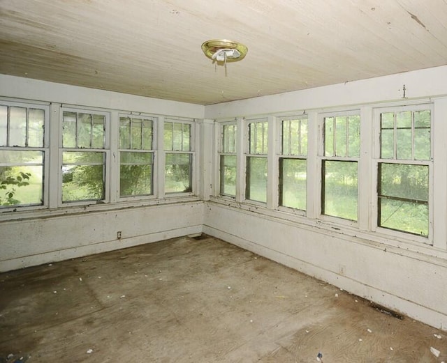 unfurnished sunroom with wooden ceiling