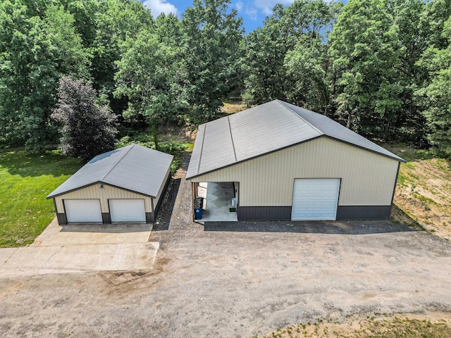 exterior space featuring an outbuilding and a garage