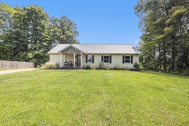 ranch-style house featuring a porch and a front yard