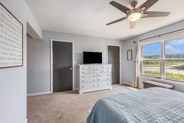 carpeted bedroom with ceiling fan