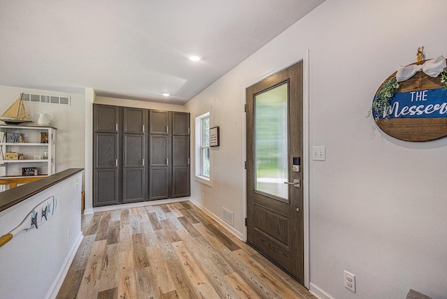 entryway with light hardwood / wood-style flooring