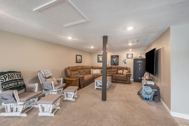 carpeted living room featuring a textured ceiling