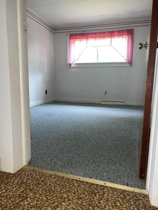 spare room with crown molding, plenty of natural light, and carpet flooring