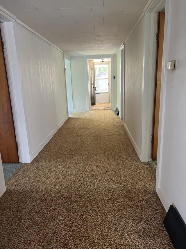 hallway featuring carpet