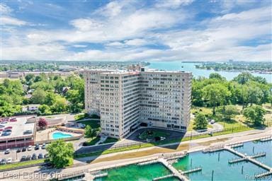 birds eye view of property with a water view