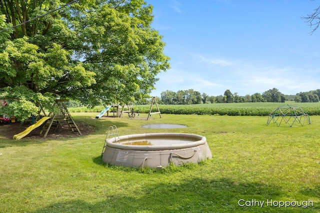 view of yard with a rural view and a playground