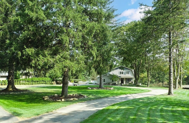 18760 Valencia St, Northville, MI 48168 - view of home's community featuring a yard