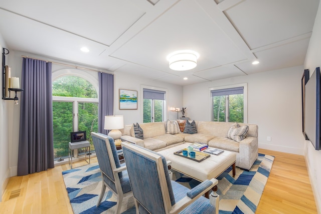 18760 Valencia St, Northville, MI 48168 - living room with baseboards, visible vents, wood finished floors, and a healthy amount of sunlight