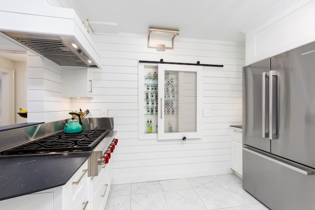 18760 Valencia St, Northville, MI 48168 - kitchen featuring marble finish floor, dark countertops, premium range hood, and appliances with stainless steel finishes
