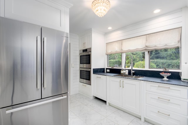 18760 Valencia St, Northville, MI 48168 - kitchen featuring marble finish floor, a sink, stainless steel appliances, and dark countertops