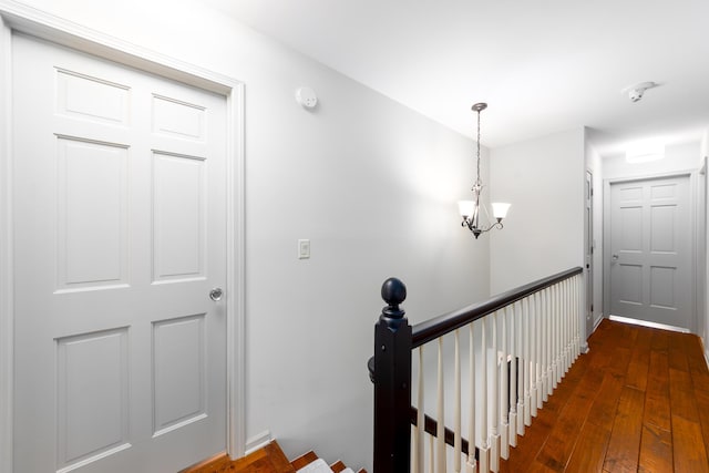 18760 Valencia St, Northville, MI 48168 - interior space with hardwood / wood-style floors and an inviting chandelier