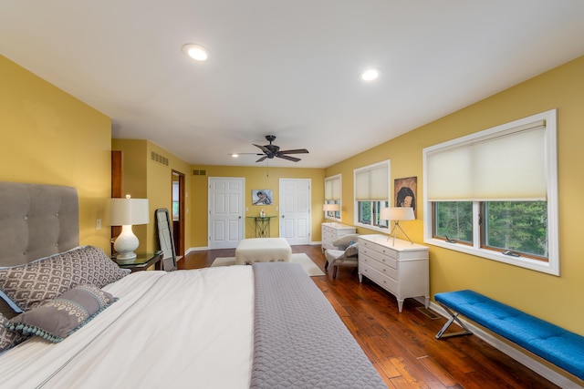 18760 Valencia St, Northville, MI 48168 - bedroom featuring visible vents, two closets, ceiling fan, recessed lighting, and dark wood-style floors